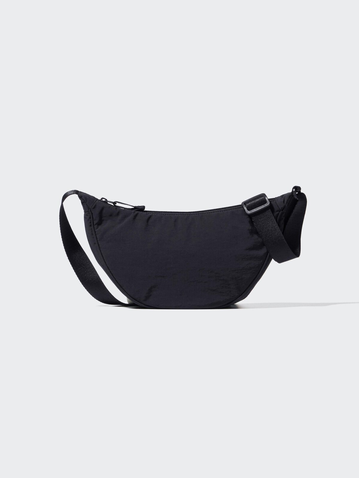 Black UNIQLO Round Mini Shoulder Bag with adjustable strap