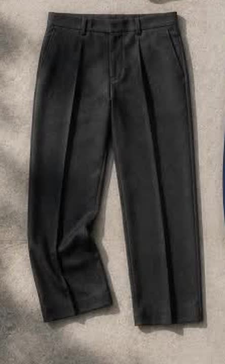 Charcoal pleated trousers photographed as part of a five-piece wardrobe; contextual image, not the six exact products