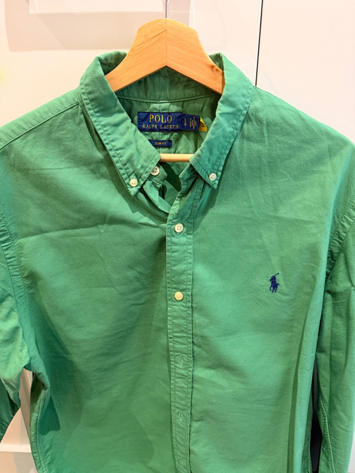 Polo Ralph Lauren green Slim Fit button-down shirt after long-term wear, photographed on a hanger by QWD