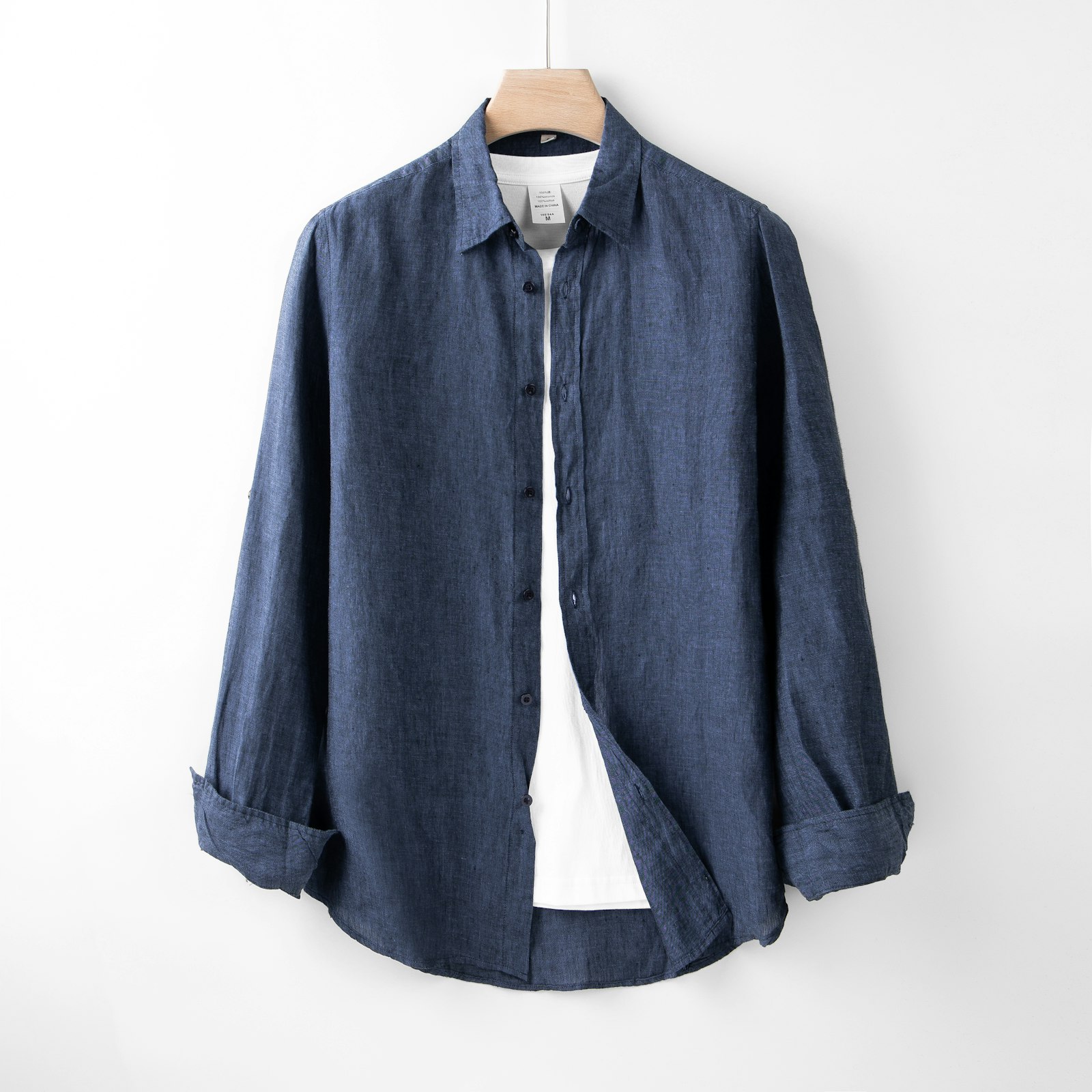 A navy linen shirt layered over a white T-shirt