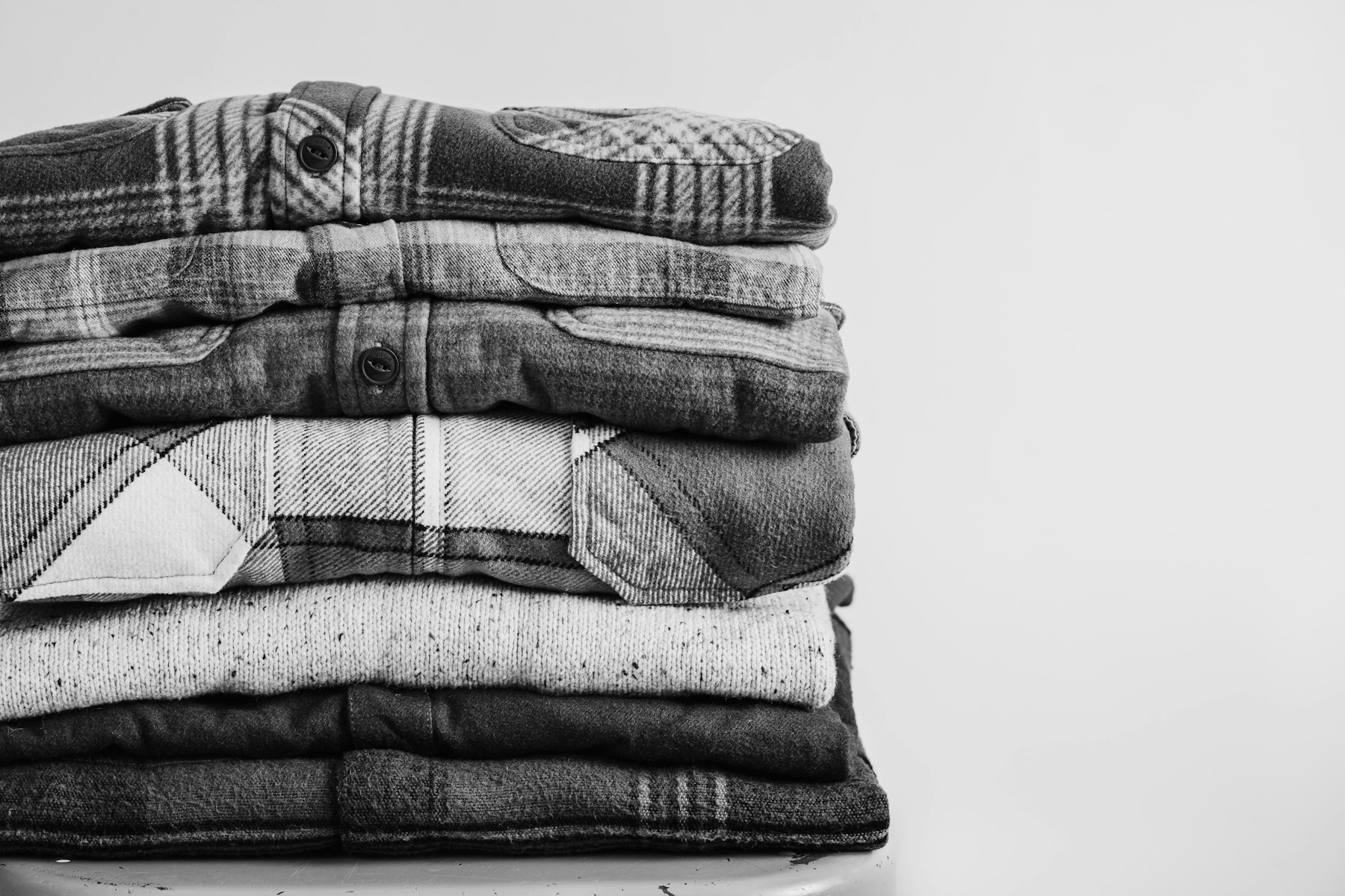 Folded shirts showing weave, seams and garment detail