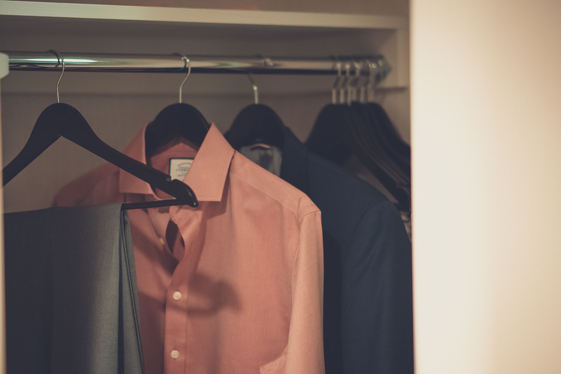 Garments arranged in a real wardrobe